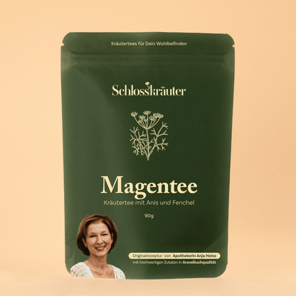 Magentee mit Anis und Fenchel in grünem Beutel auf beigem Hintergrund
