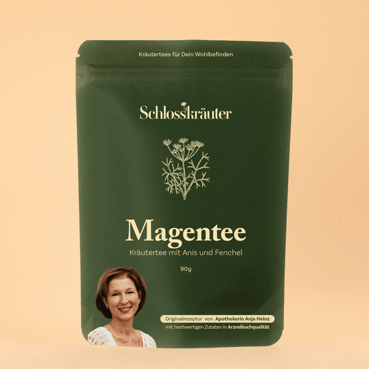 Magentee mit Anis und Fenchel in grünem Beutel auf beigem Hintergrund